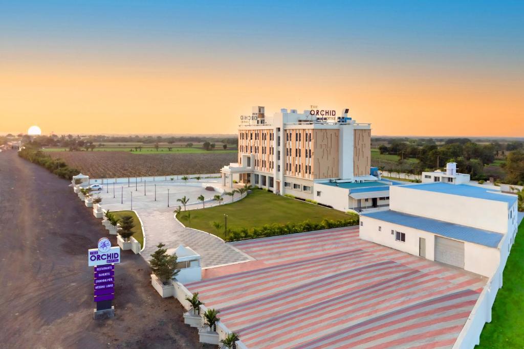 an aerial view of a hotel with the sunset at The Orchid Jamnagar in Jamnagar