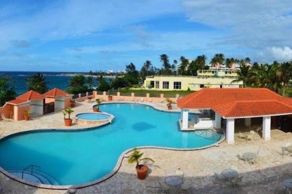 an image of a swimming pool at a resort at Beachfront Studio Apt w/ Full Kitchen & Pool in Isabela
