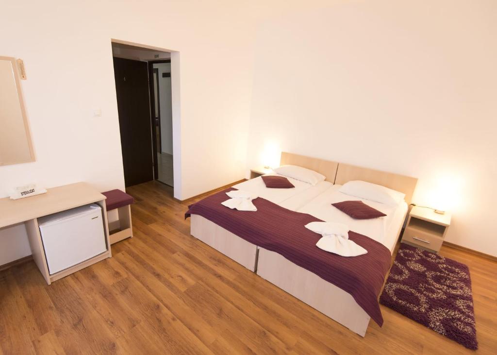 Postel nebo postele na pokoji v ubytování Vila Rigo Sovata