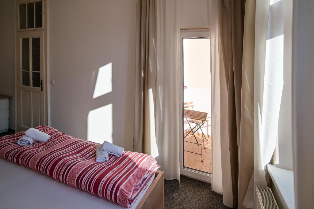 Postel nebo postele na pokoji v ubytování Stodolní Apartment