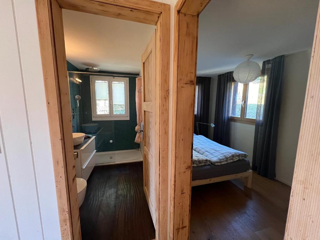 Postel nebo postele na pokoji v ubytování Chalet Friesli Beatenberg