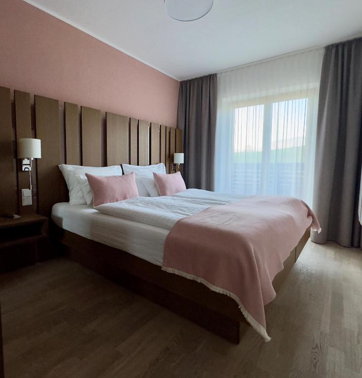 Postel nebo postele na pokoji v ubytování Apartmenthotel 's Mitterndorf