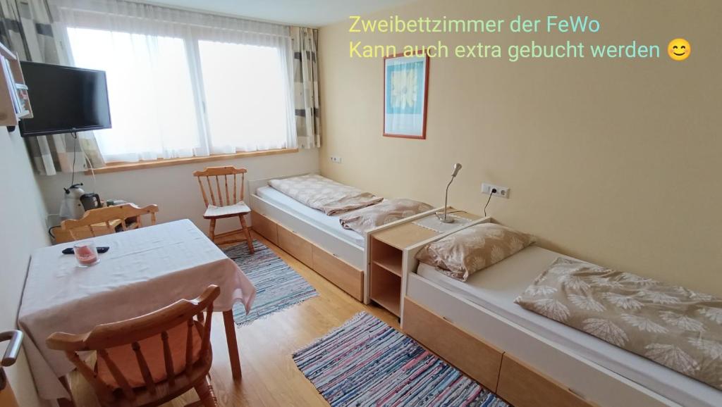 Postel nebo postele na pokoji v ubytování Gästehaus Lutz