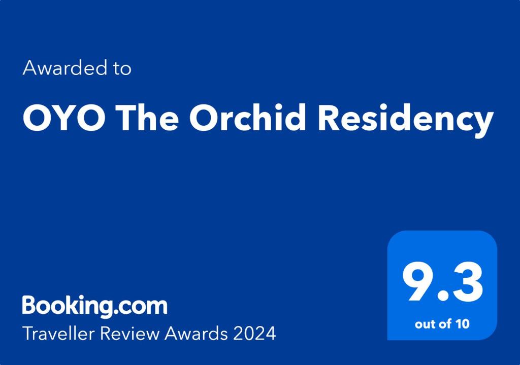 um sinal azul com as palavras oxo a residência da orquídea em Super OYO The Orchid Residency em Calcutá