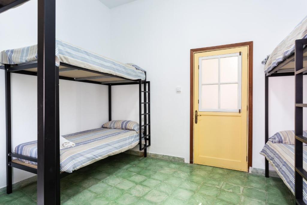 Postel nebo postele na pokoji v ubytování El Hostal del Cubo