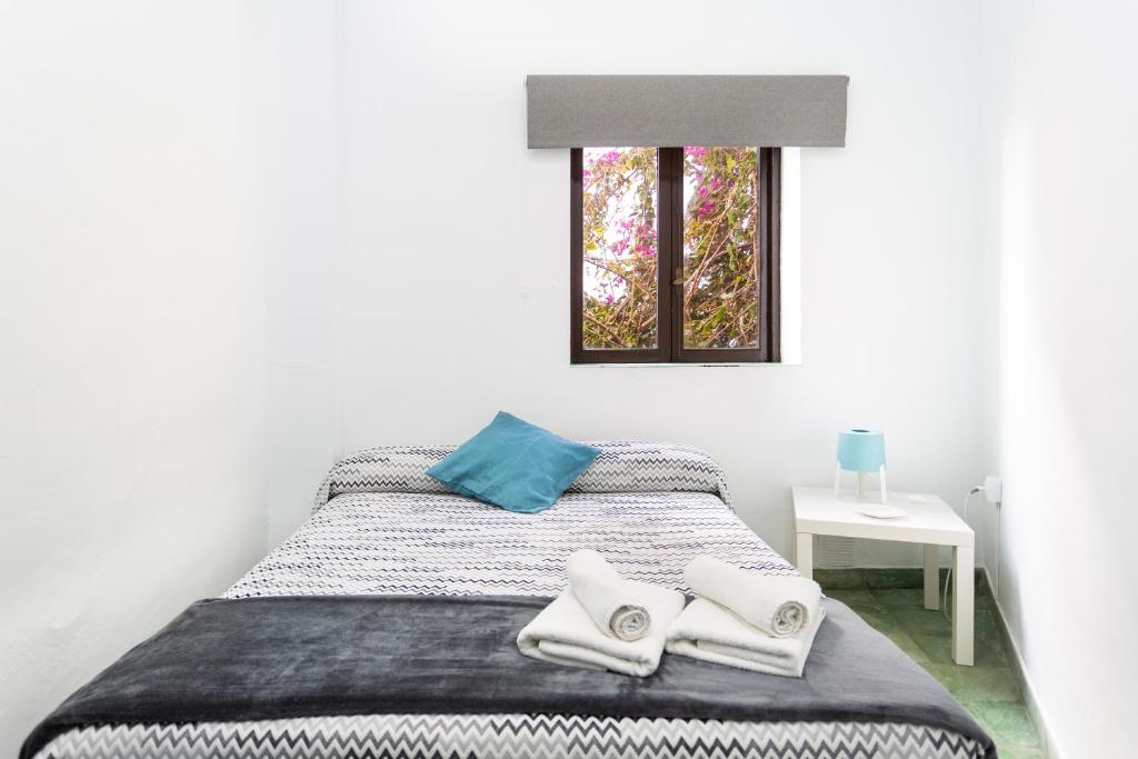 Postel nebo postele na pokoji v ubytování El Hostal del Cubo