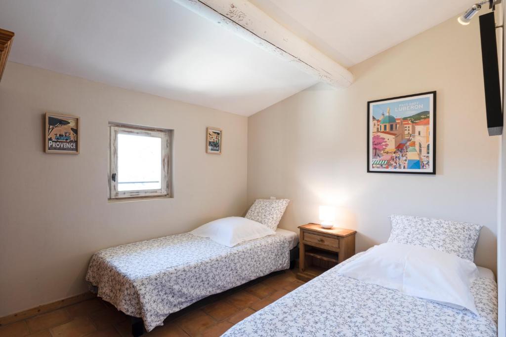La Bastide des Milles tesisinde bir odada yatak veya yataklar