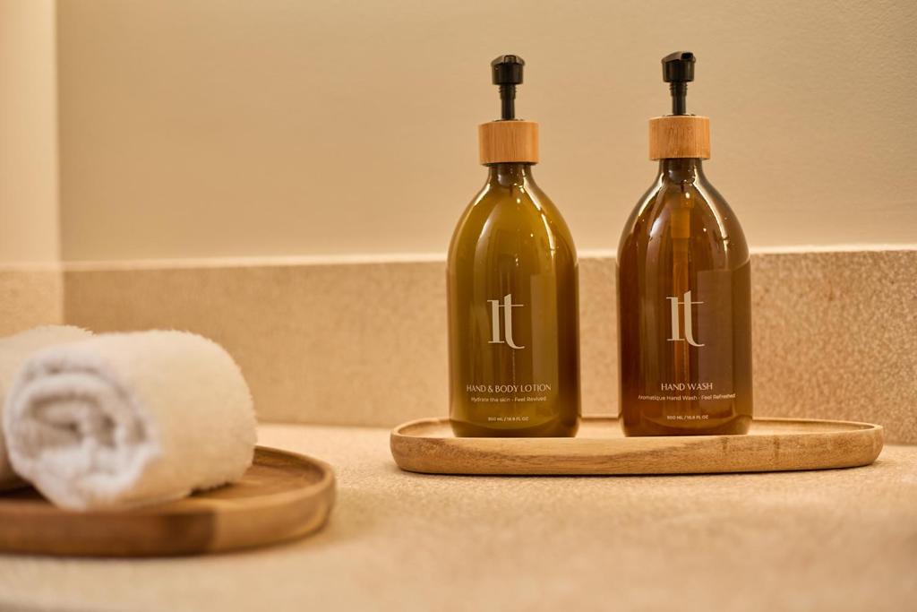 two bottles of soap and a roll of toilet paper at Sant Jaume Design Hotel in Palma de Mallorca