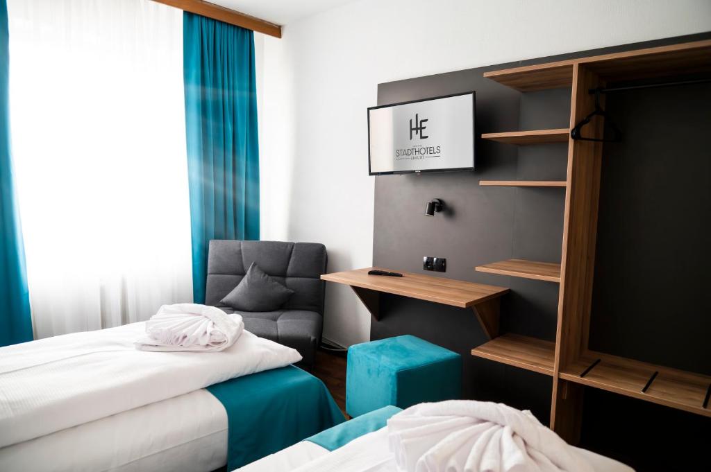 Postel nebo postele na pokoji v ubytování Hotel Hansa Stuttgart City