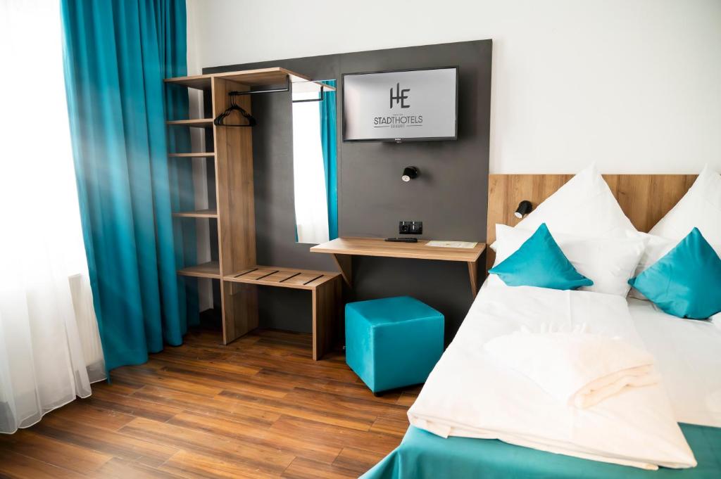 Postel nebo postele na pokoji v ubytování Hotel Hansa Stuttgart City