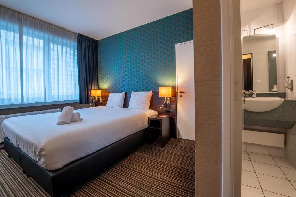 Postel nebo postele na pokoji v ubytování Hotel Docklands