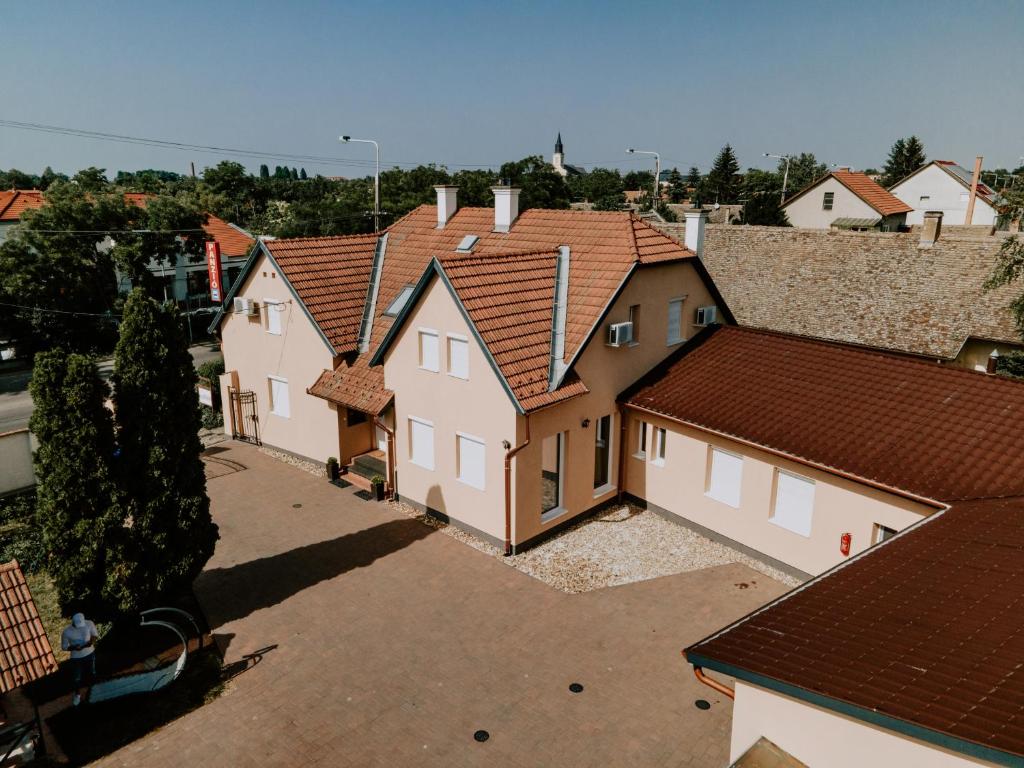 an overhead view of a row of houses with roofs at Aranyhíd Vendégház in Makó