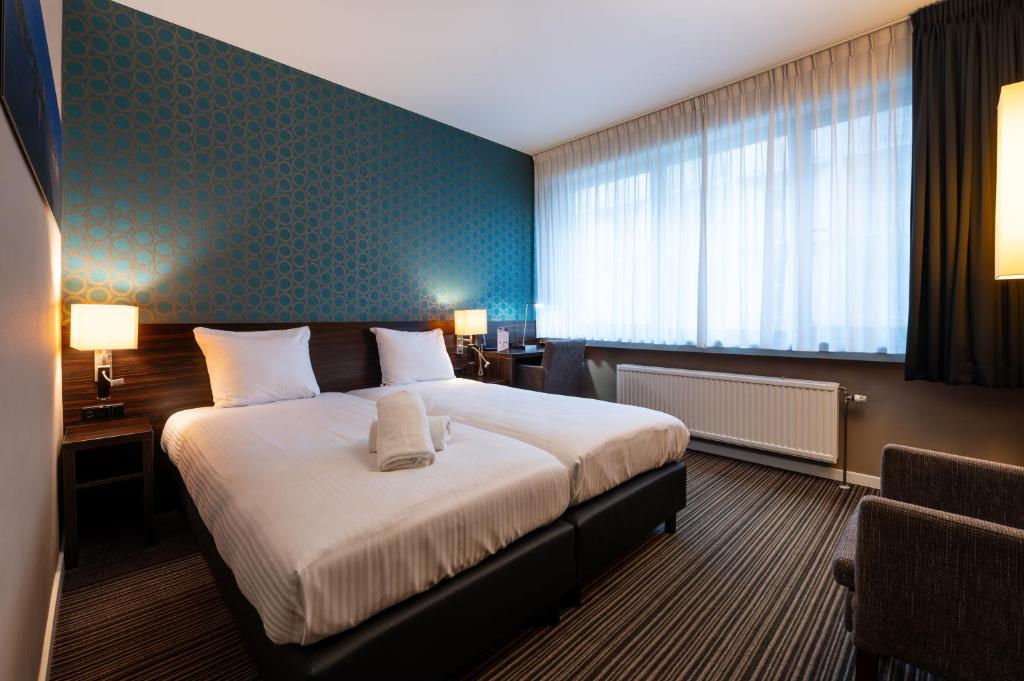 Postel nebo postele na pokoji v ubytování Hotel Docklands