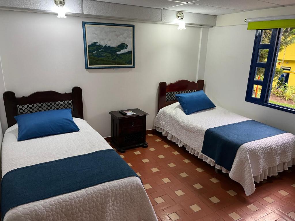 Voodi või voodid majutusasutuse Ecohotel La Casona Pereira toas