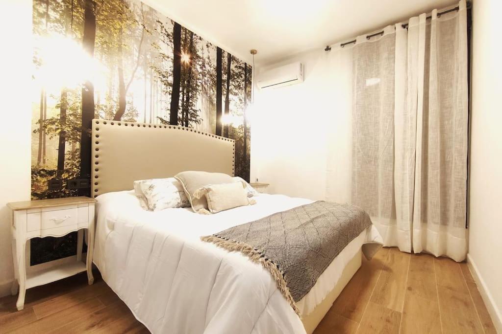 Postelja oz. postelje v sobi nastanitve Oasis Suites Fernando IV