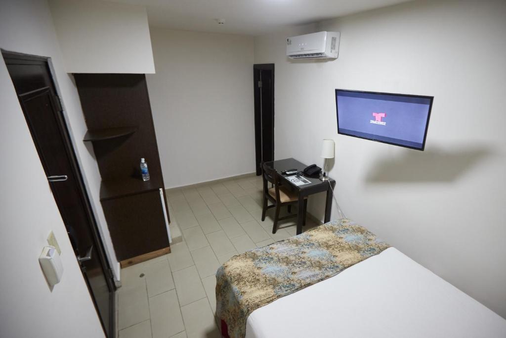 TV a/nebo společenská místnost v ubytování Metro Hotel Panama