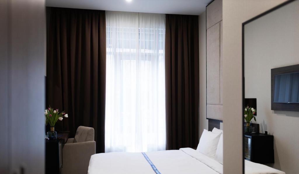 Postel nebo postele na pokoji v ubytování Ribas Rooms Odesa