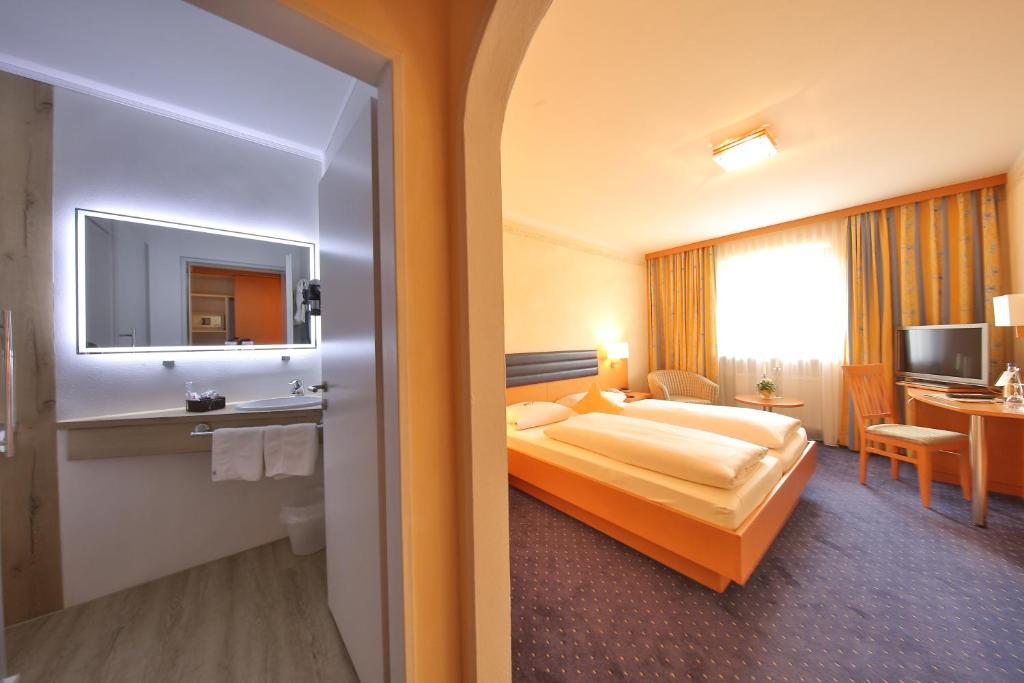 Postel nebo postele na pokoji v ubytování Hotel Bockmaier