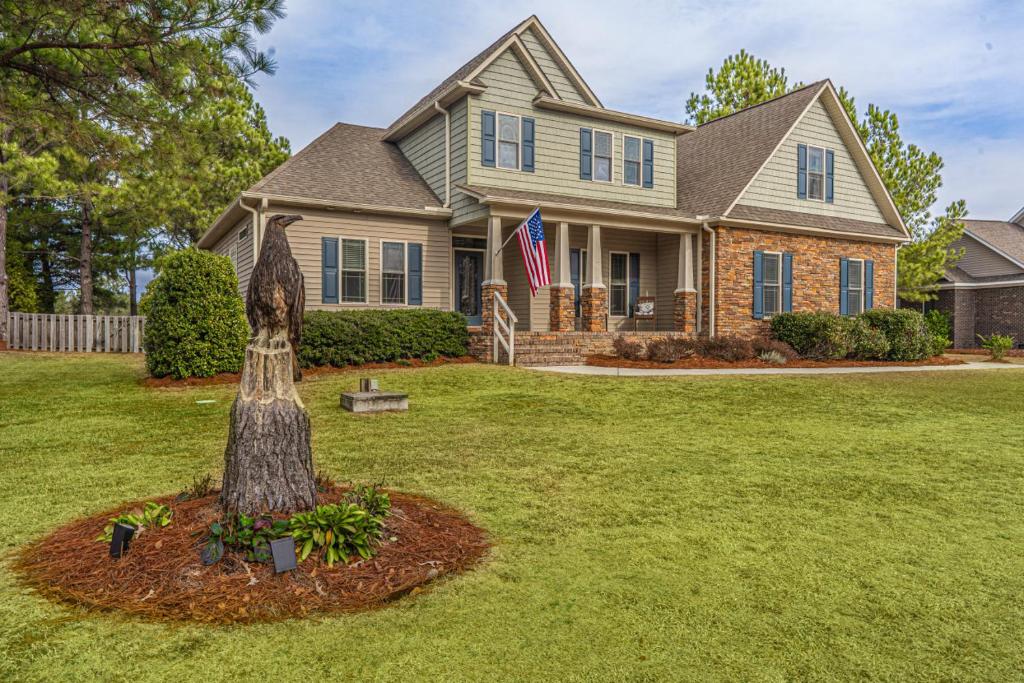 a house with a tree in front of it at Sleeps 8- in Carthage in Carthage