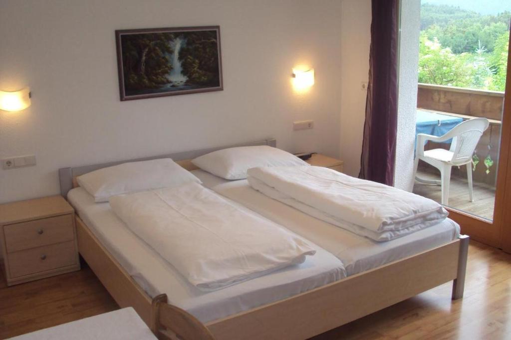 Łóżko lub łóżka w pokoju w obiekcie Residence Klementhof 1