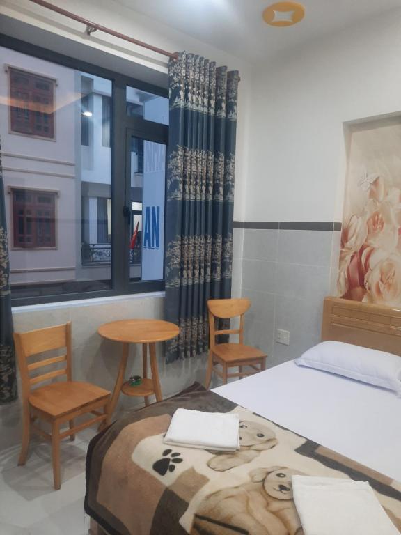 Postel nebo postele na pokoji v ubytování Nhà Nghỉ An Toàn