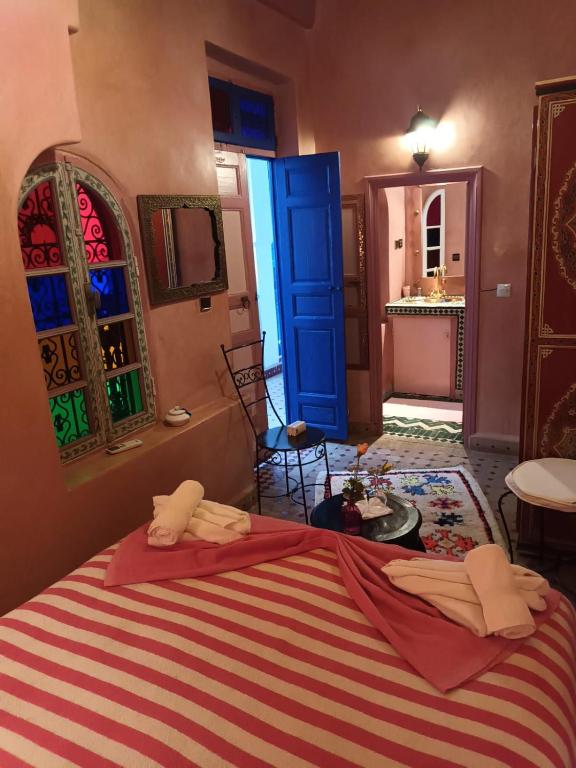 Postel nebo postele na pokoji v ubytování Riad Dar Colline