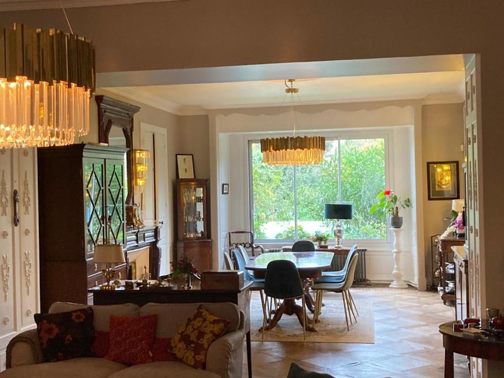 a living room with a couch and a table at La Gueriniere l'anglaise in Châteauneuf-sur-Charente