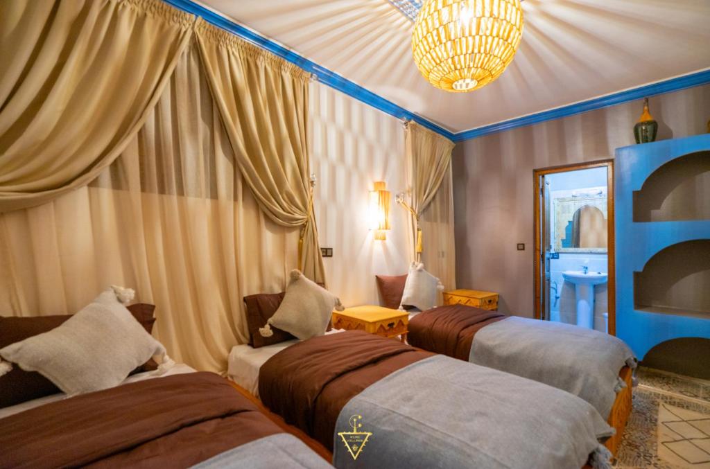 Postel nebo postele na pokoji v ubytování Riad Village