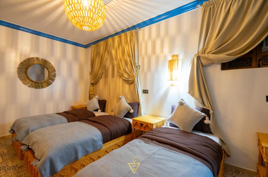 Postel nebo postele na pokoji v ubytování Riad Village