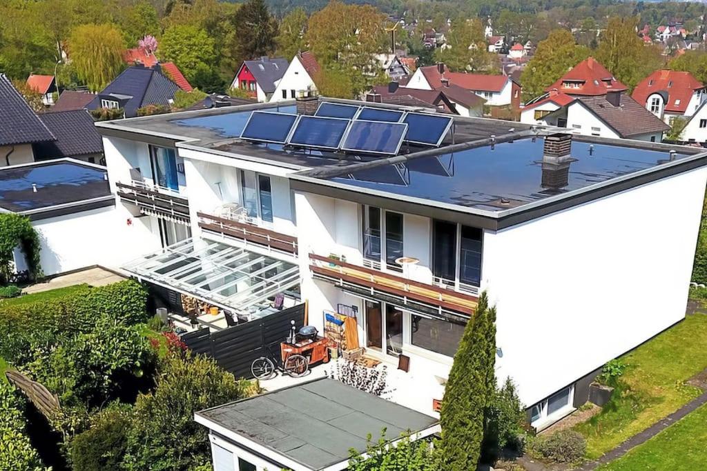 an aerial view of a house with solar panels on the roof at Ferienhaus am Teutoburger Wald in Detmold