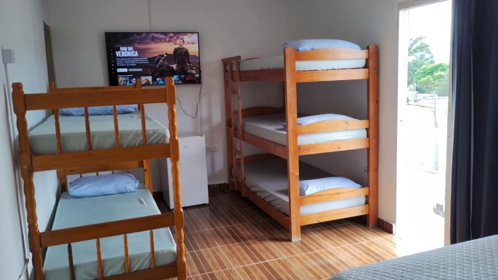 Postel nebo postele na pokoji v ubytování Pousada Do Léo