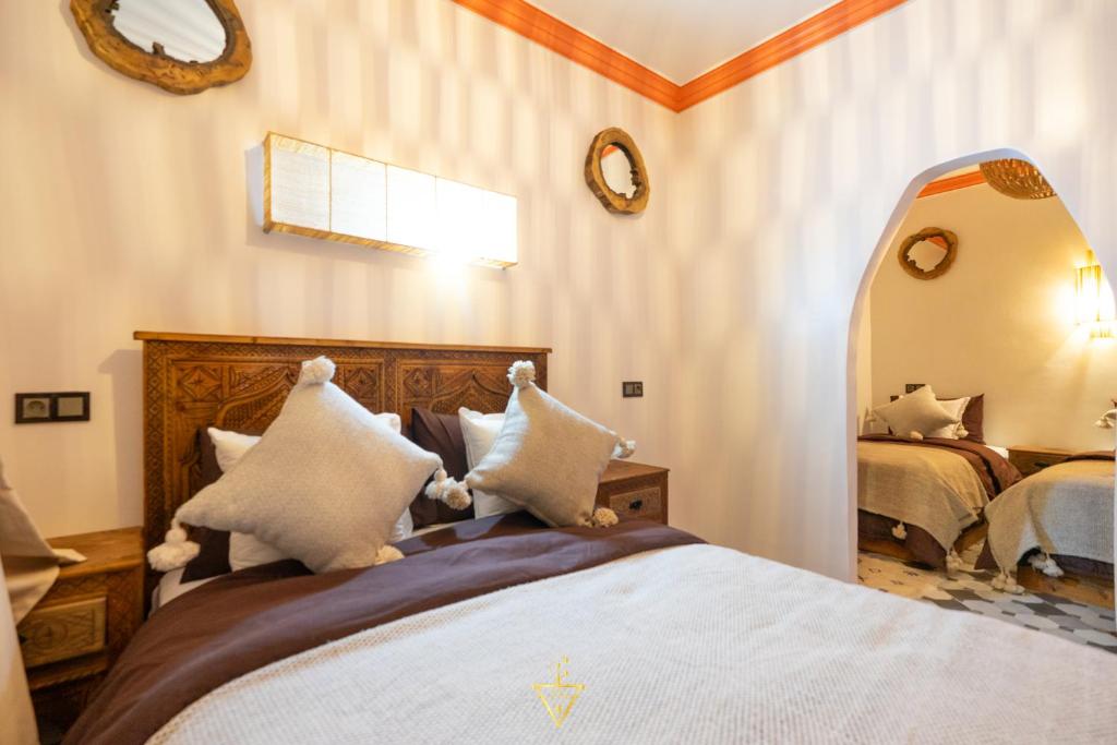 Postel nebo postele na pokoji v ubytování Riad Village
