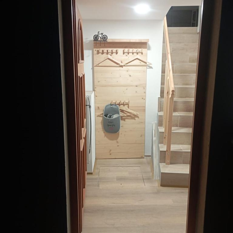 a hallway with a stairway leading into a house at Apartmán Putim in Písek