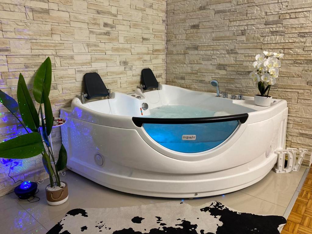a bath tub in a room with at Dolce Vita in Vinkovci