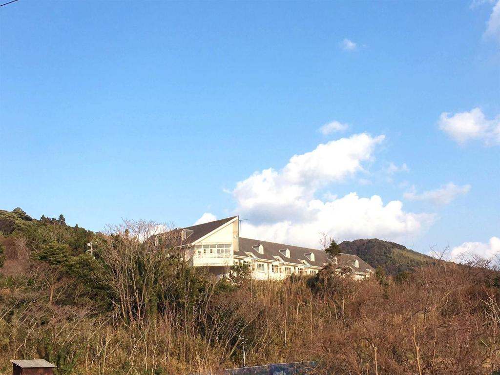 a house on the side of a hill at Umi no Gohanya Noramare - Vacation STAY 63517v in Masuda
