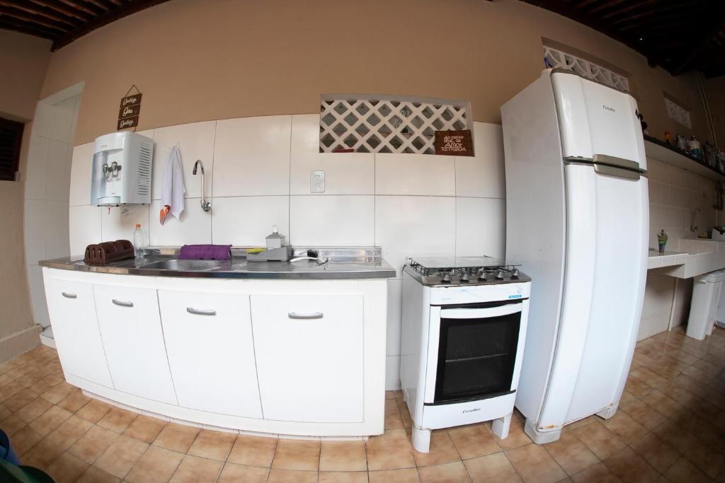 Kuchyň nebo kuchyňský kout v ubytování A Oca Hostel Bar