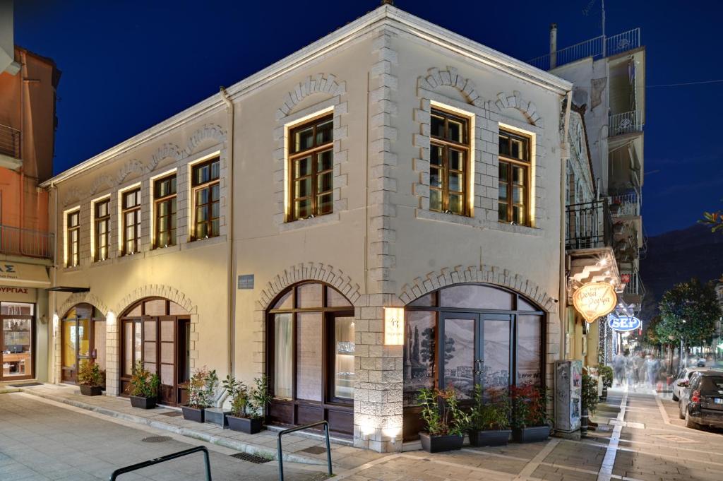 a building on the corner of a street at night at 43 Ave in Ioannina