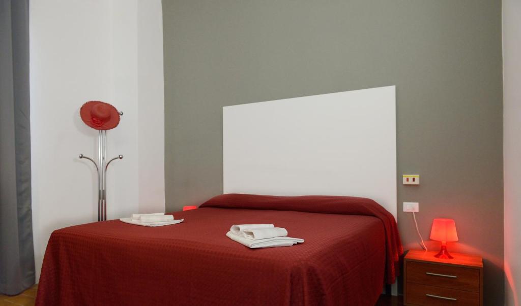 Postel nebo postele na pokoji v ubytování Hotel Piccola Firenze