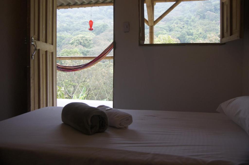 Postel nebo postele na pokoji v ubytování Hostal Vista Verde Minca