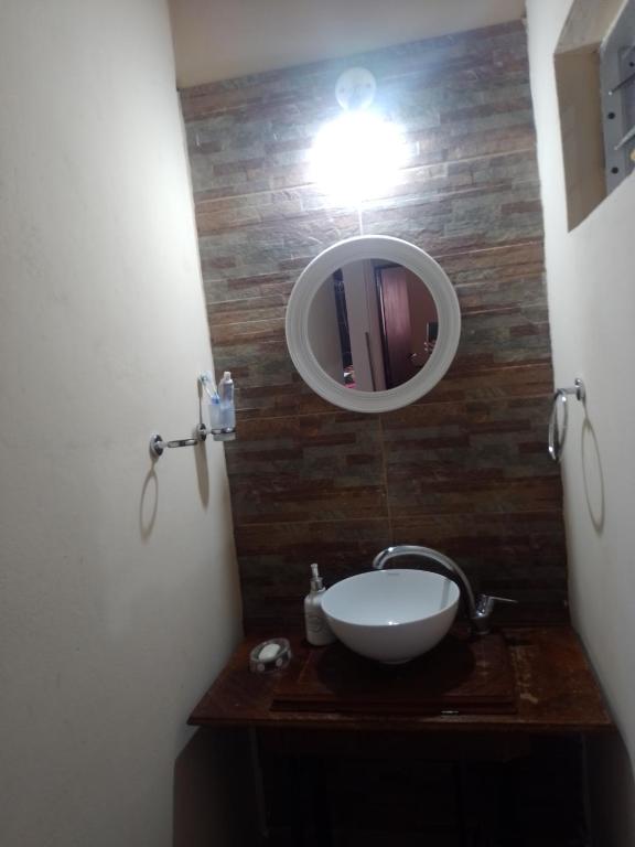 a bathroom with a sink and a mirror at Paz y Eva in Salta