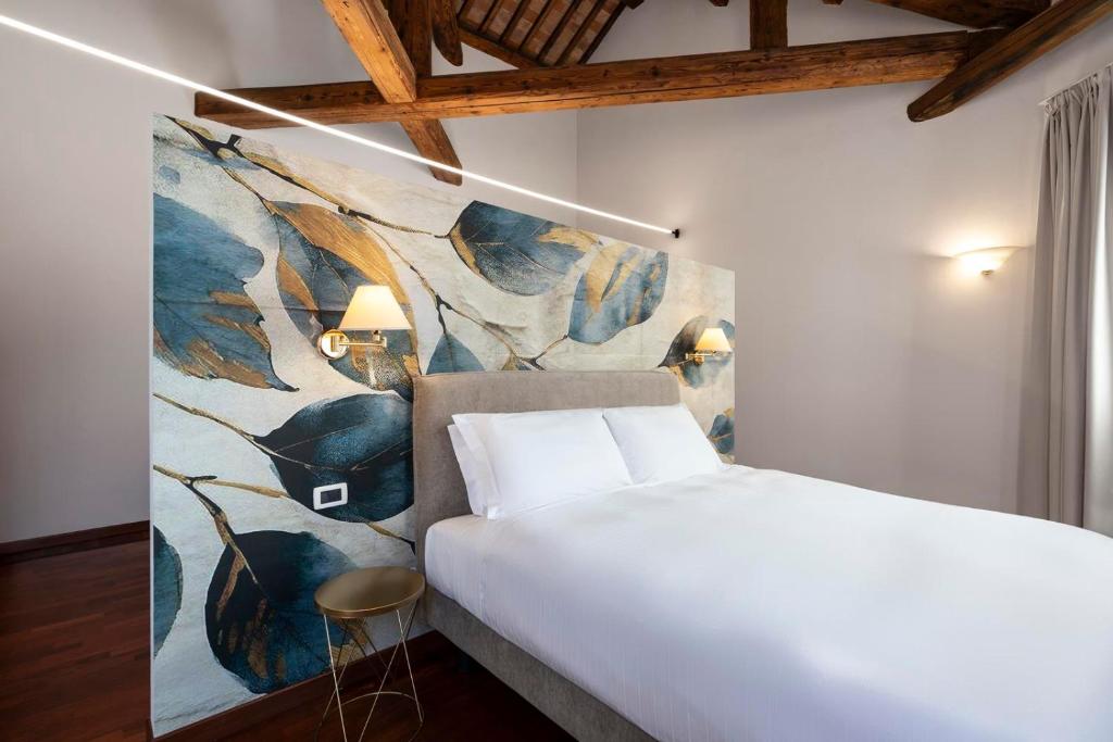 Postel nebo postele na pokoji v ubytování Hotel Alle Acque