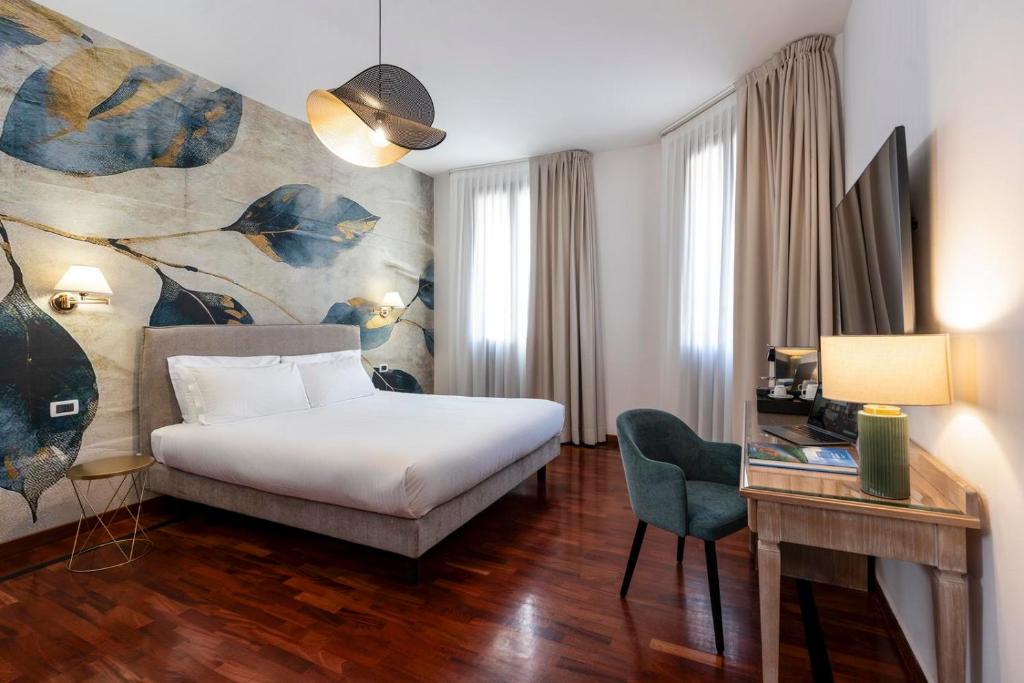 Postel nebo postele na pokoji v ubytování Hotel Alle Acque