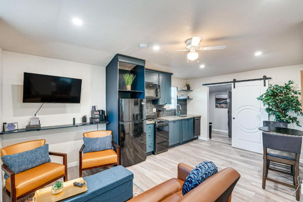 a living room with a couch and chairs and a kitchen at Welcoming Sacramento Home Less Than 5 Mi to Downtown! in Sacramento