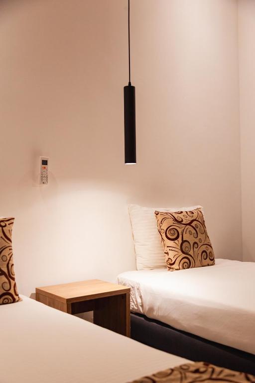 Postel nebo postele na pokoji v ubytování Hotel Laureles Loft