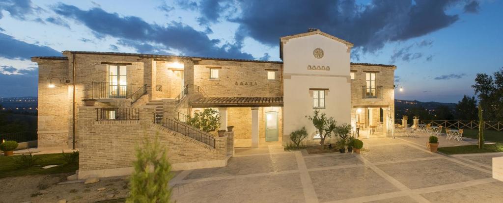 a large brick building with a clock on it at Villa Sant'Angelo in Alba Adriatica
