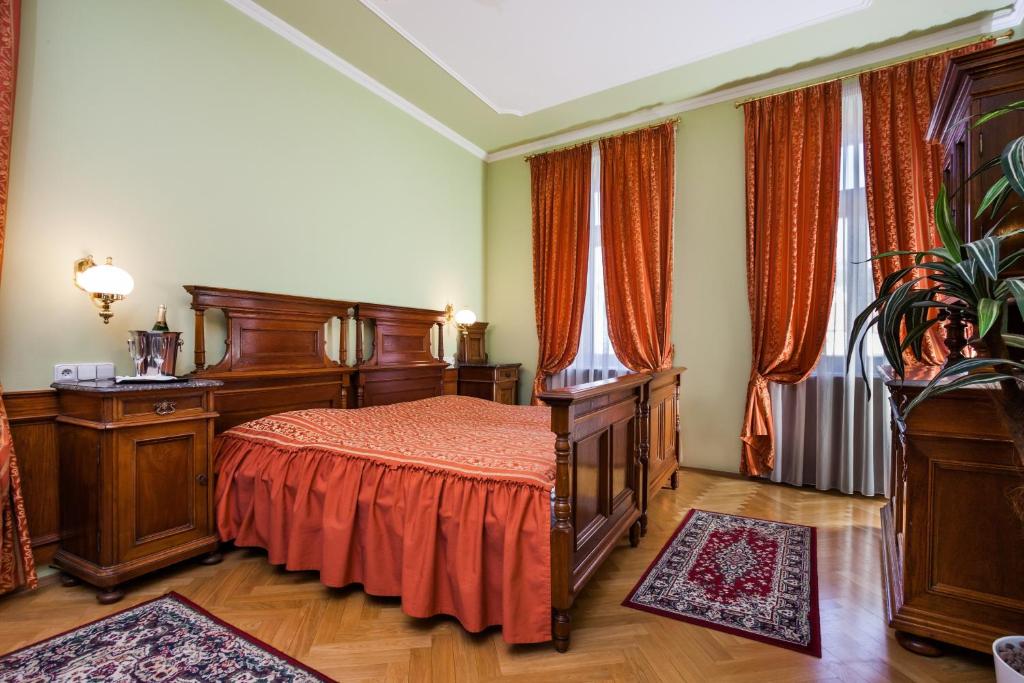 Postel nebo postele na pokoji v ubytování Hotel Jelínkova vila