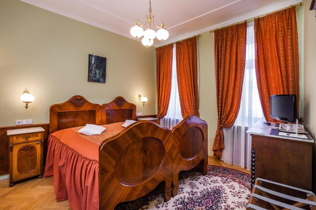 Postel nebo postele na pokoji v ubytování Hotel Jelínkova vila