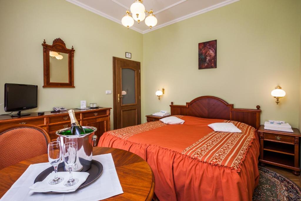 Postel nebo postele na pokoji v ubytování Hotel Jelínkova vila