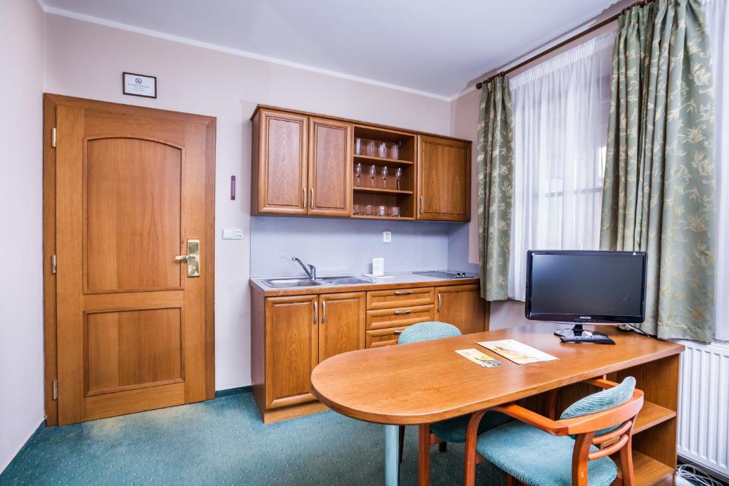 Kuchyň nebo kuchyňský kout v ubytování Hotel Jelínkova vila