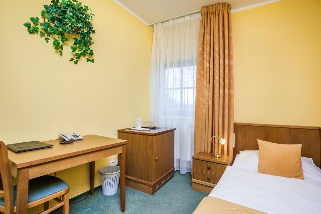 Postel nebo postele na pokoji v ubytování Hotel Jelínkova vila